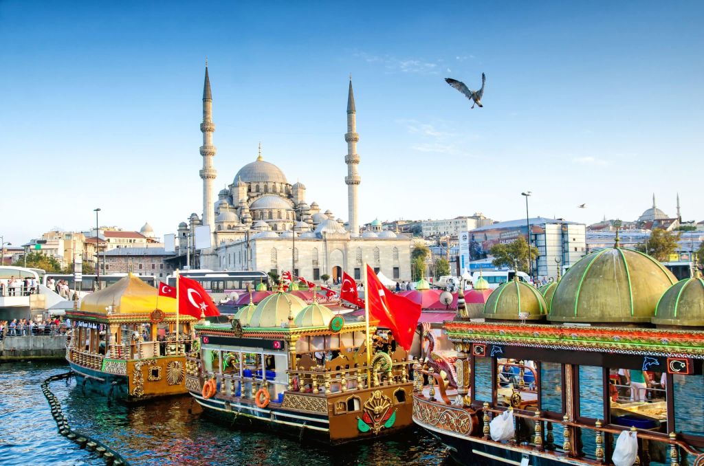 ISTANBUL, TURKEY – October 6, 2015: View of the Suleymaniye Mosque and fishing boats in Eminonu, Istanbul, Turkey