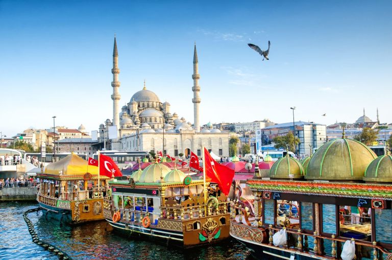 ISTANBUL, TURKEY – October 6, 2015: View of the Suleymaniye Mosque and fishing boats in Eminonu, Istanbul, Turkey