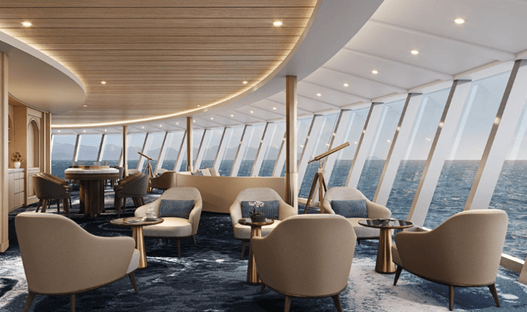 Observation lounge with beige armchairs, brass telescopes and curved windows overlooking the sea.