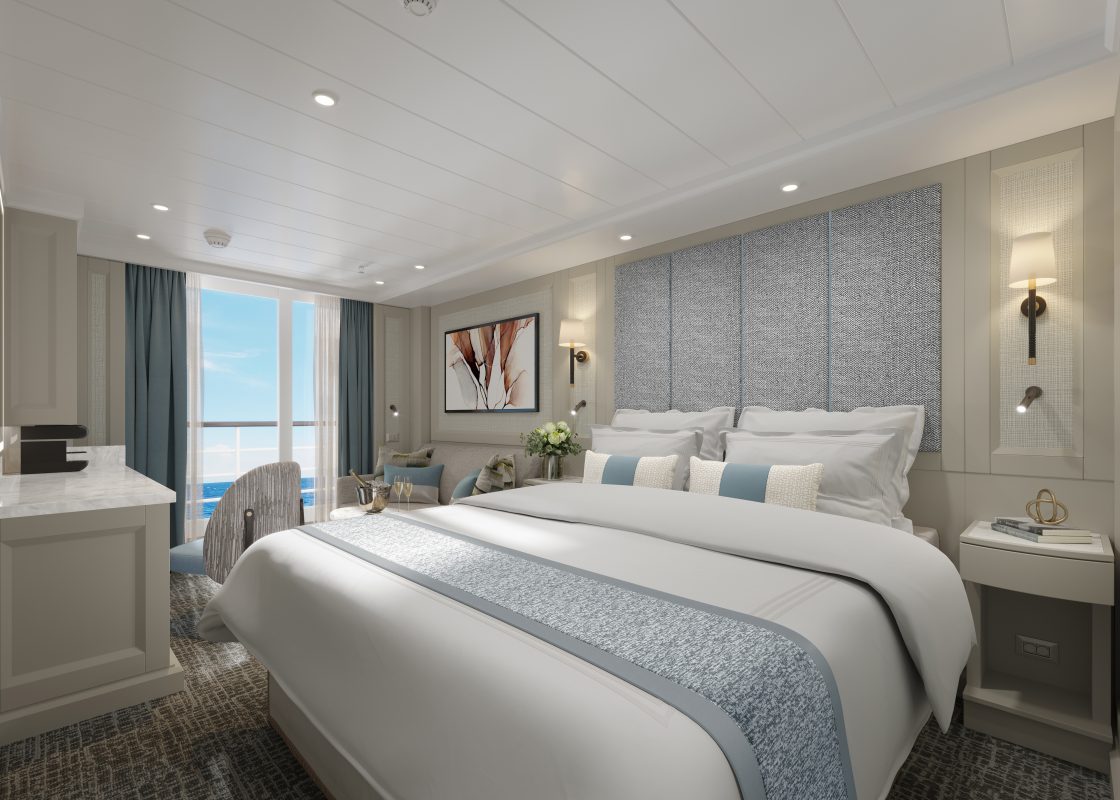 Hotel room with two double beds, blue-gray accents, wall lamps, and a window with an ocean view.