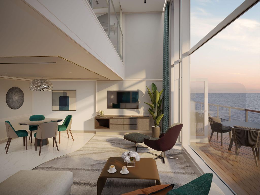 Bright modern living/dining area with white walls, teal chairs, a glass dining table, and a large floor-to-ceiling window showing an ocean view at sunset/late afternoon.