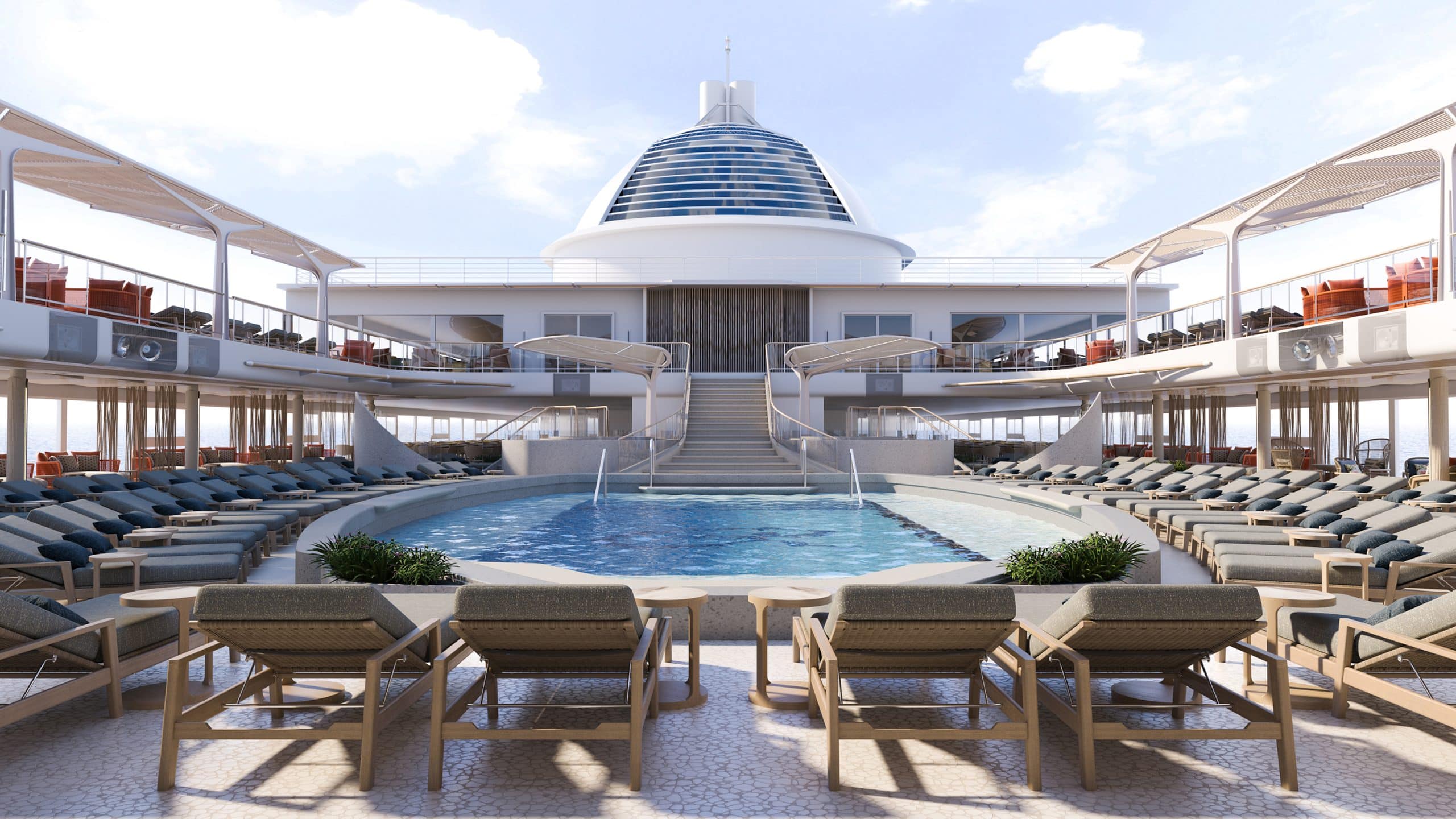 Luxurious cruise ship pool deck with many lounge chairs surrounding a curved pool and a modern central building behind.