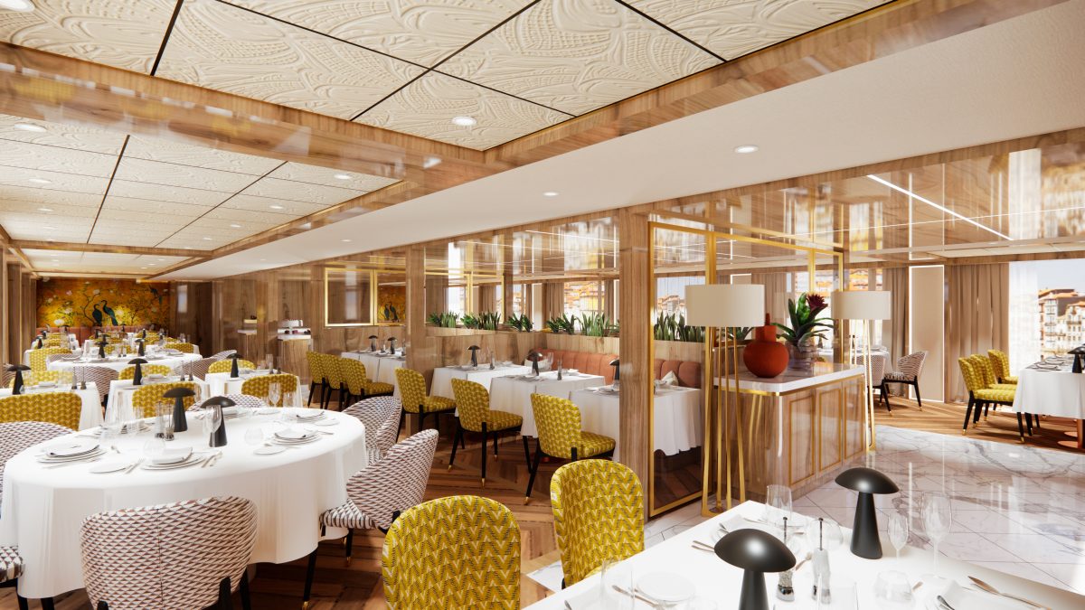 Luxurious restaurant dining area with round tables, white tablecloths, yellow patterned chairs, and glass partitions.